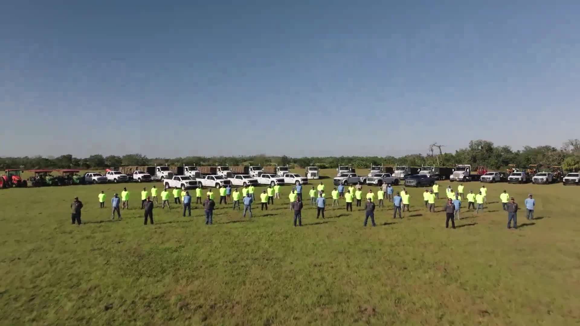 AgriScape team, trucks, and equipment
